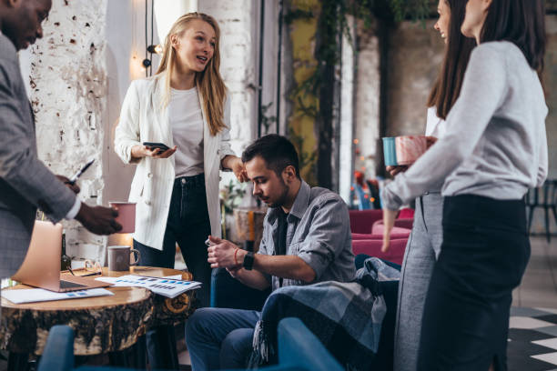 istock Group of students sitting together and studying 1366491090
