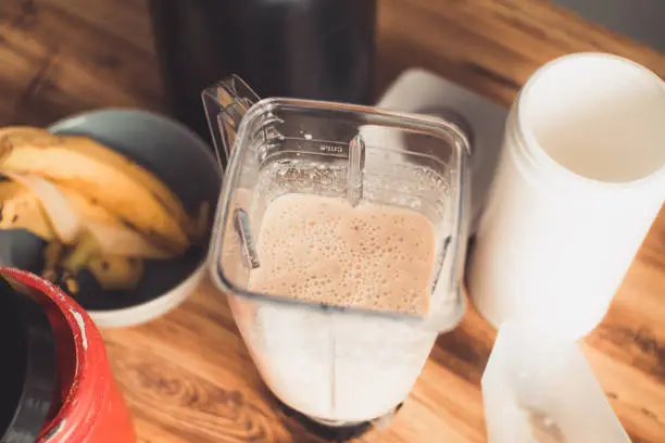 Overhead shot of a blender glass with a nutritious smoothie, healthy lifestyle concept.