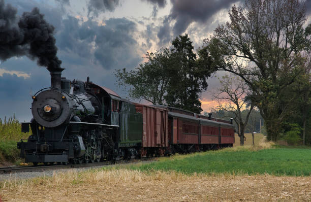 istock Antique Restored Steam Freight Train Approaching Head on Blowing Smoke and Steam 1366493806