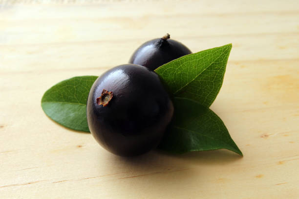 istock Exotic Jabuticaba fruit on wooden table 1366495760
