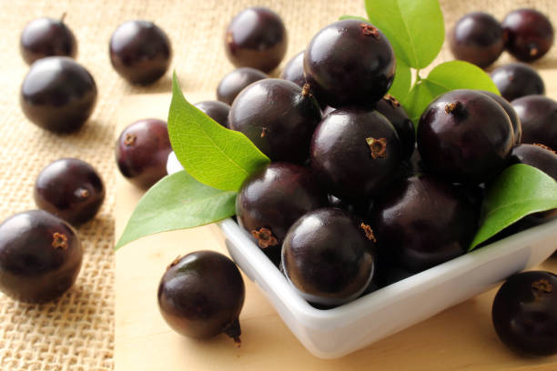 istock Exotic Jabuticaba fruit on wooden table 1366495772