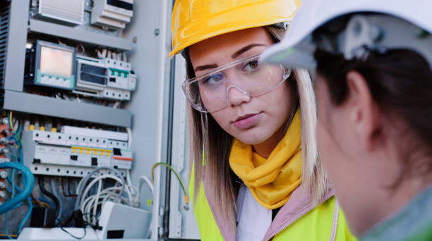 istock Female engineers working in solar power plant. Teamwork. Renewable energy systems. Solar city. 1366499716