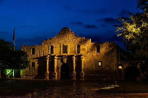 The Alamo lit up before sunrise in San Antonio, Texas.