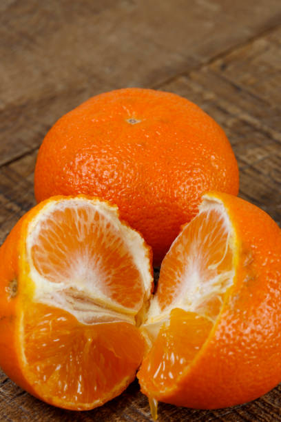 istock Mandarin orange on rustic wooden table 1366502676