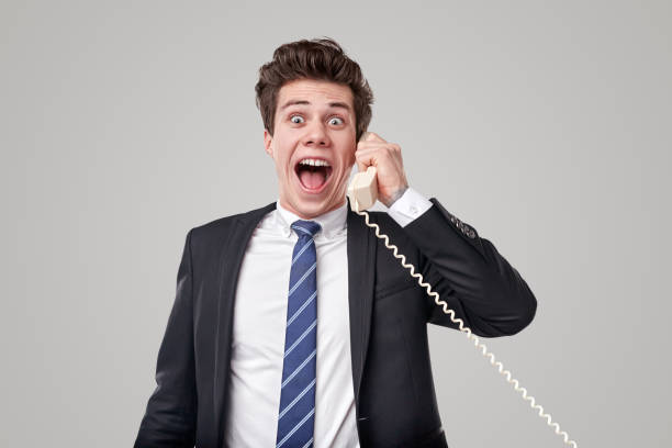 istock Happy worker talking on telephone with excitement 1366505347