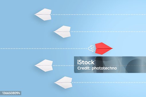 istock Change concepts with red paper airplane leading among white 1366508094