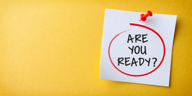 istock White Sticky Note With Are You Ready And Red Push Pin On Yellow Background 1366508159