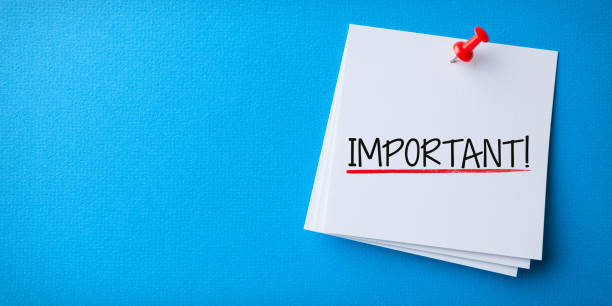 White Sticky Note With Important And Red Push Pin On Blue Background stock photo