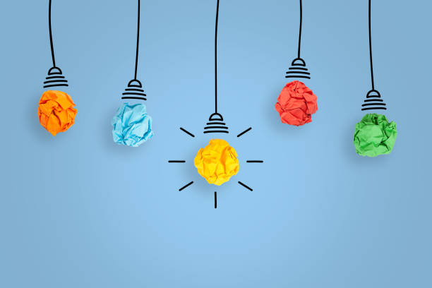 istock Creative Idea Concepts with Light Bulb Crumpled Paper on Blue Background 1366508787