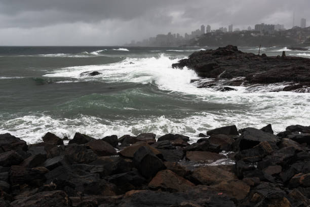 istock Rough sea crashing on the beach rocks. 1366511180