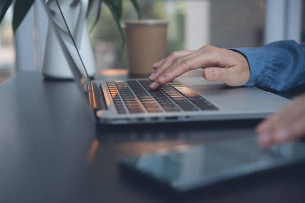 istock Business woman typing on laptop computer 1366514570