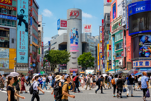 Tokyo, Japan - January 24, 2022: Shibuya Scramble Crossing is a world famous and iconic intersection in Shibuya, Tokyo, Japan. The scramble is famous for being the busiest crossing in the world.