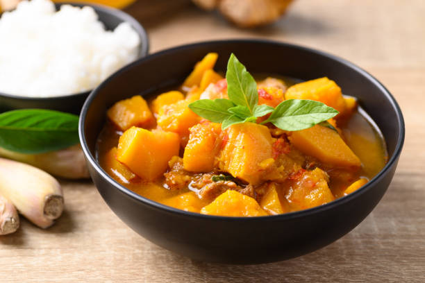 istock Thai spicy pumpkin curry soup with pork 1366521573