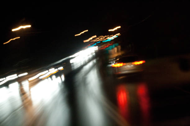 istock Abstract of car on highway at night 1366521693