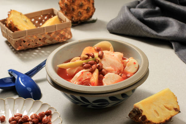 istock Asinan Bogor. Popular fruit pickles with peanuts and noodle crackers from Bogor, West Java. 1366521777
