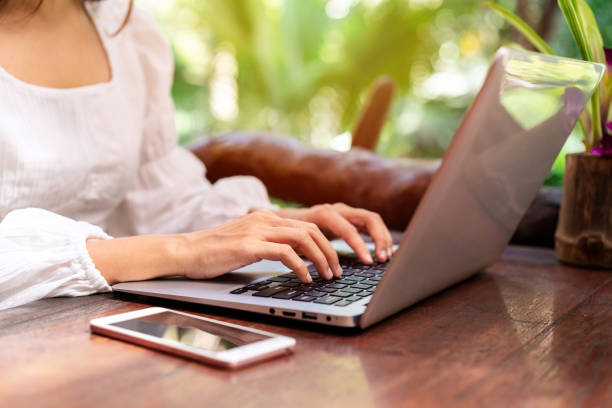 istock Young woman freelancer traveler working online using laptop while traveling on vacation, Freelance concept 1366522619