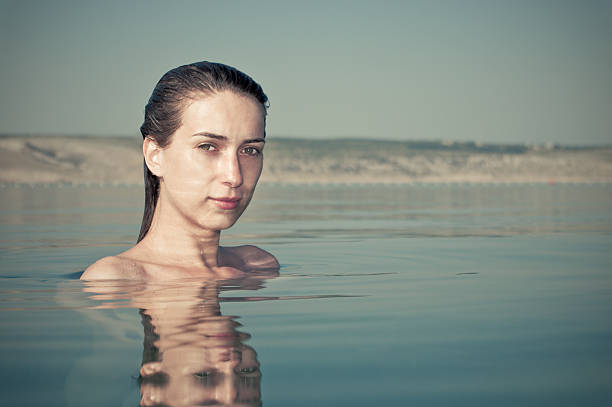 istock Young woman in the water 136652502