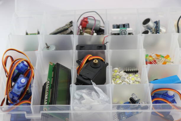 istock Collection of microcontroller parts in a box, Micro servo, LCD display and other electronic components for building stem projects for students 1366525288