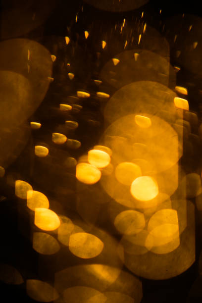 istock Abstract light warm background, blurring on long exposure of light rays and glare 1366532457