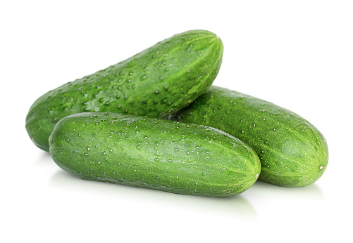 three cucumbers on isolated white background