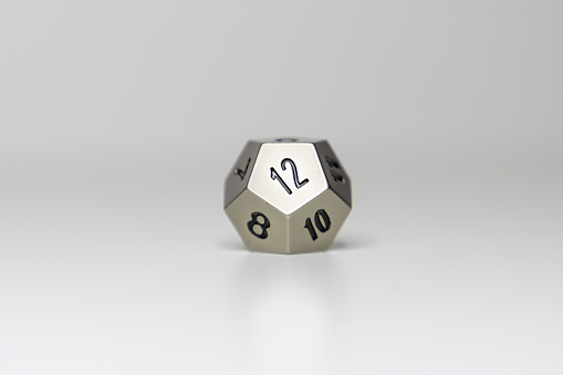 A 12-sided dice sits in the center of a simple white background.