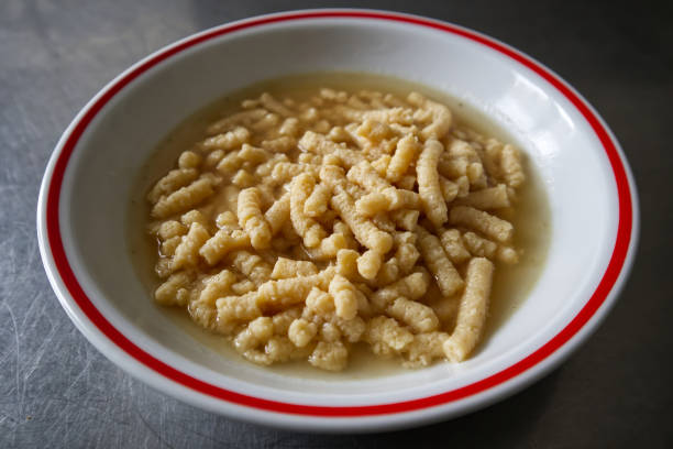 Homemade Italian Passatelli. Traditional Italian pasta cooked in broth. View from above. Bologna, Italy. stock photo