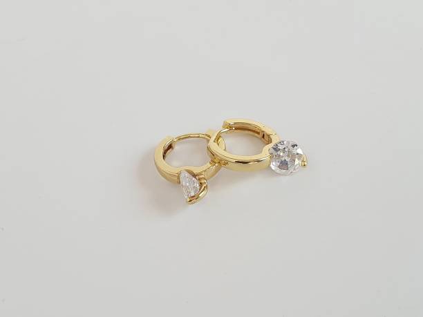 istock Gold Hoop Earrings with Crystals 1366536331