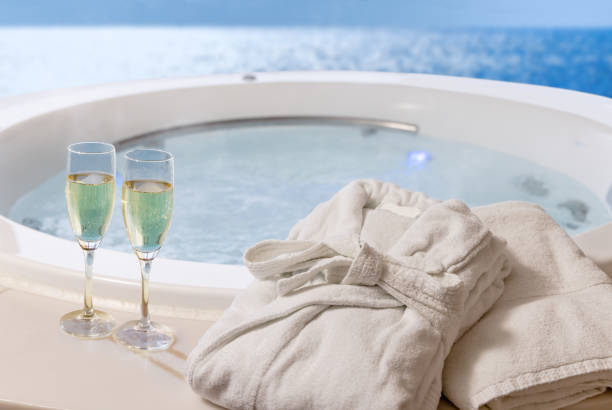 istock Champagne and bathrobes and a relaxing whirlpool 1366538158