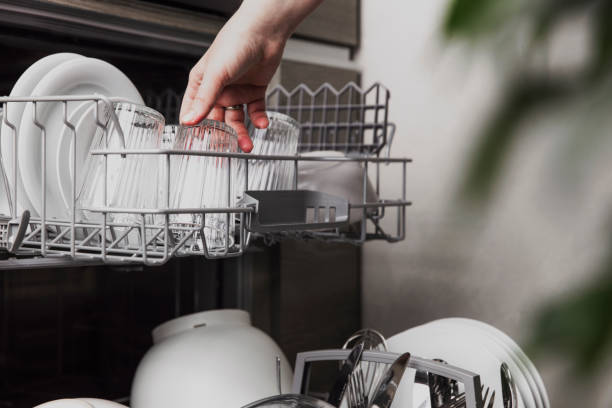 istock Open dishwasher with clean cutlery, glasses, dishes inside in the home kitchen 1366538344