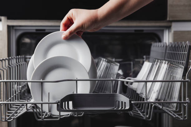 istock Open dishwasher with clean cutlery, glasses, dishes inside in the home kitchen 1366538348