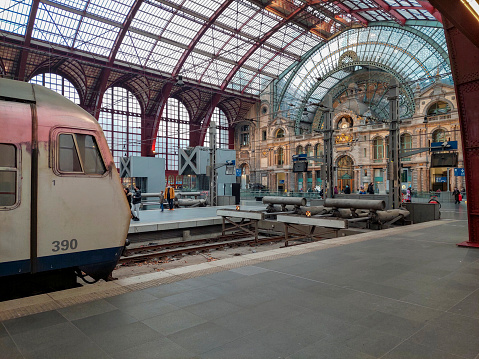 Antwerp, Belgium, January 2022: View on the train platform arrival hall of Antwerp railway station in Belgium