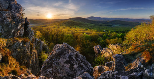 istock Sunset landscape panorame with spring forest - Tribec, Slovakia 1366542237