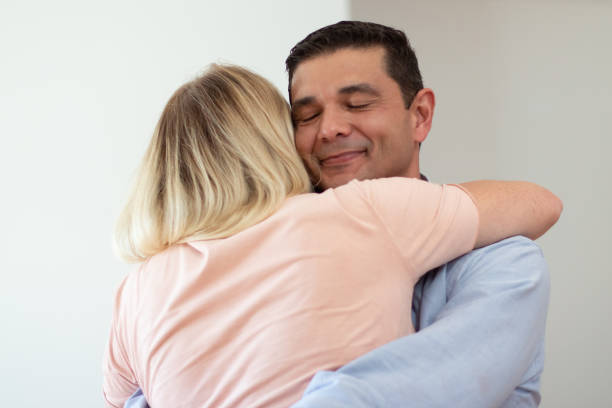 istock Happy loving husband hugging wife 1366542940