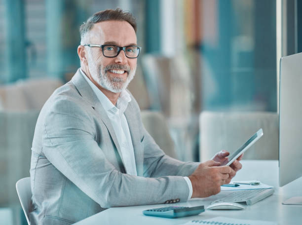 istock Shot of a businessman using a cellphone at work in a office 1366545390