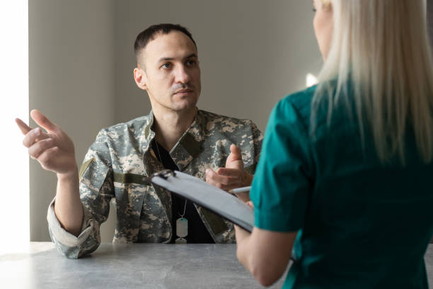 istock Soldier sitting on the sofa during psychological therapy 1366548842