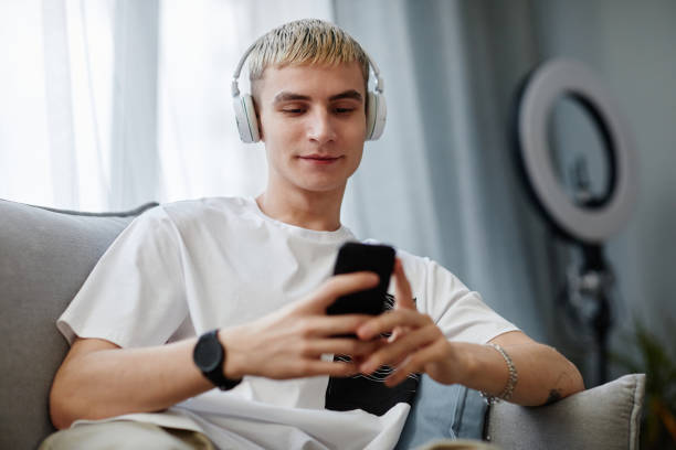 istock Young Man Listening to Music 1366553634