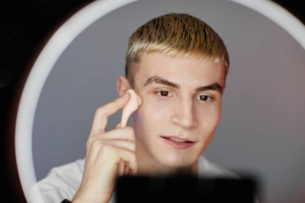 istock Young Man using Face Massager in Beauty Video 1366553655
