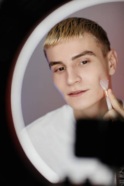 Blonde Young Man Filming Beauty Video