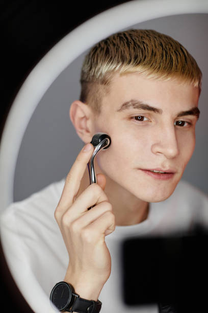 istock Young Man Filming Beauty Video 1366553661