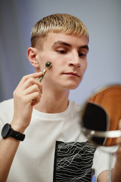 istock Young Man Enjoying Skincare at Home 1366553669