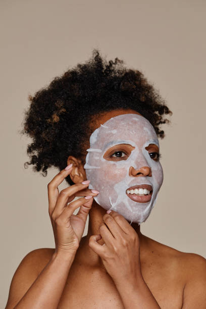 istock Smiling Woman with Beauty Mask 1366553714
