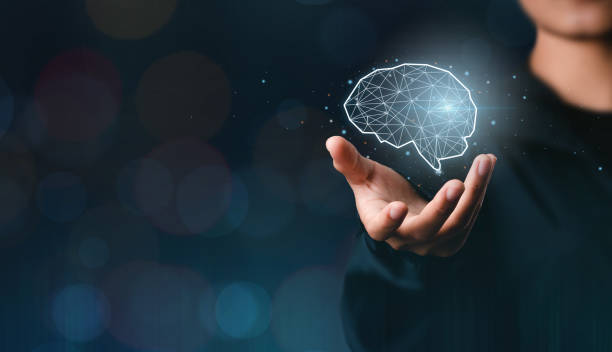 istock Businessman showing his virtual glowing brain on blue bokeh background. smart thinking concept and innovative ideas inspired 1366554061