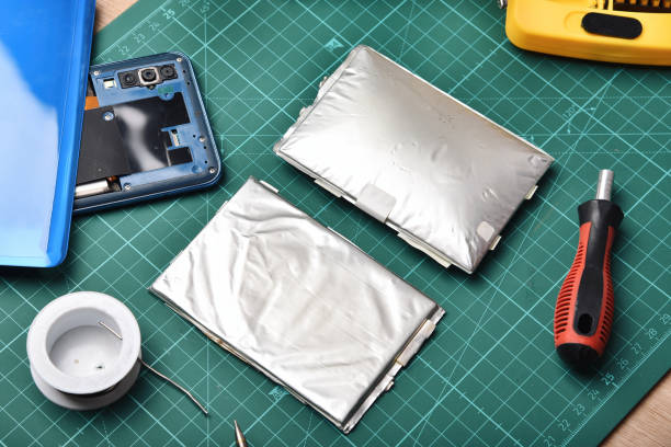 istock Smart phone repair, Broken battery replacement, Lithium polymer battery swollen dangerous to explode and catch on fire, Fix damaged smartphone. 1366556881