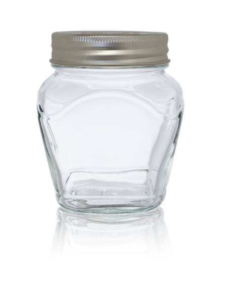 istock Empty glass jar, closed with a metal lid. On a white background, close-up with reflection 1366556935
