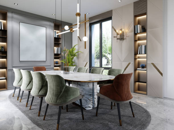 istock Luxurious dining room with a large marble table and ten different colored chairs with shelves for decor and a beige and green wall with a painting. 1366557592