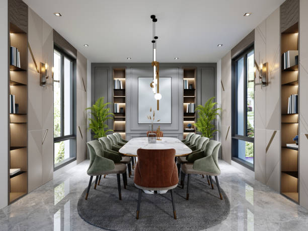 istock Luxurious dining room with a large marble table and ten different colored chairs with shelves for decor and a beige and green wall with a painting. 1366557607