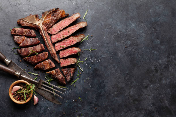 istock Grilled porterhouse beef steak. Sliced T-bone 1366560014
