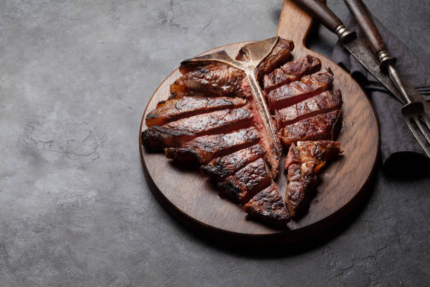 istock Grilled porterhouse beef steak. Sliced T-bone 1366560044
