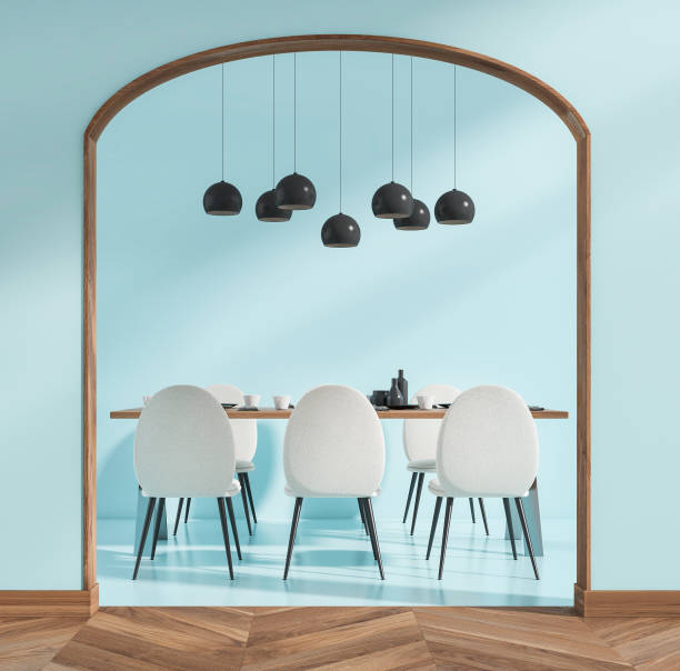 istock Light blue dining room interior with table and six chairs, arch entrance 1366561437