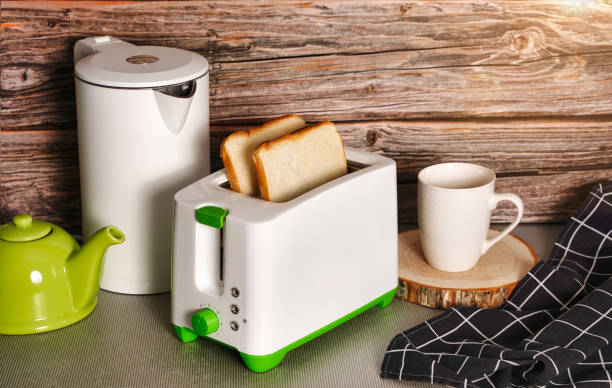 istock White kettle and toaster mockup stand on a kitchen table on a wooden wall background 1366562592